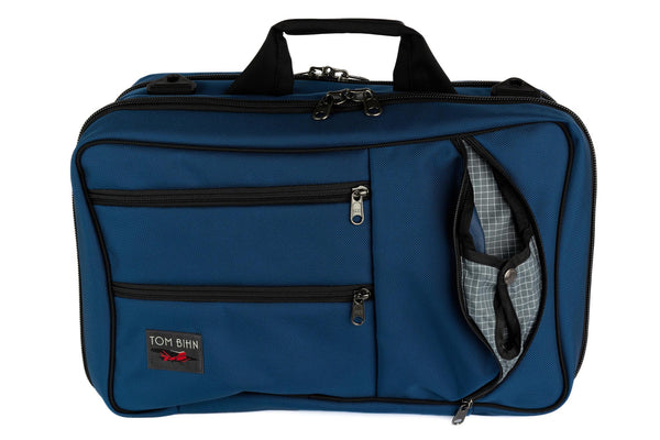 A Western Flyer in Navy (blue) 1050 Ballistic with an Northwest Sky (grey with white grid) 200 Halcyon interior.